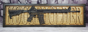 AR-15 Rifle With Last Name Behind It